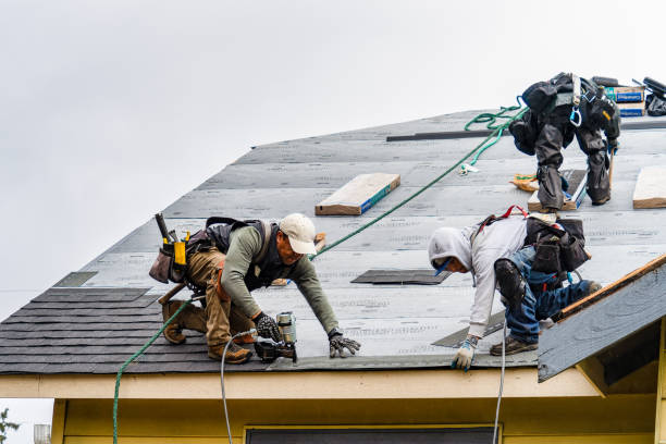 Professional Gutter Installation technician working in Natick, MA